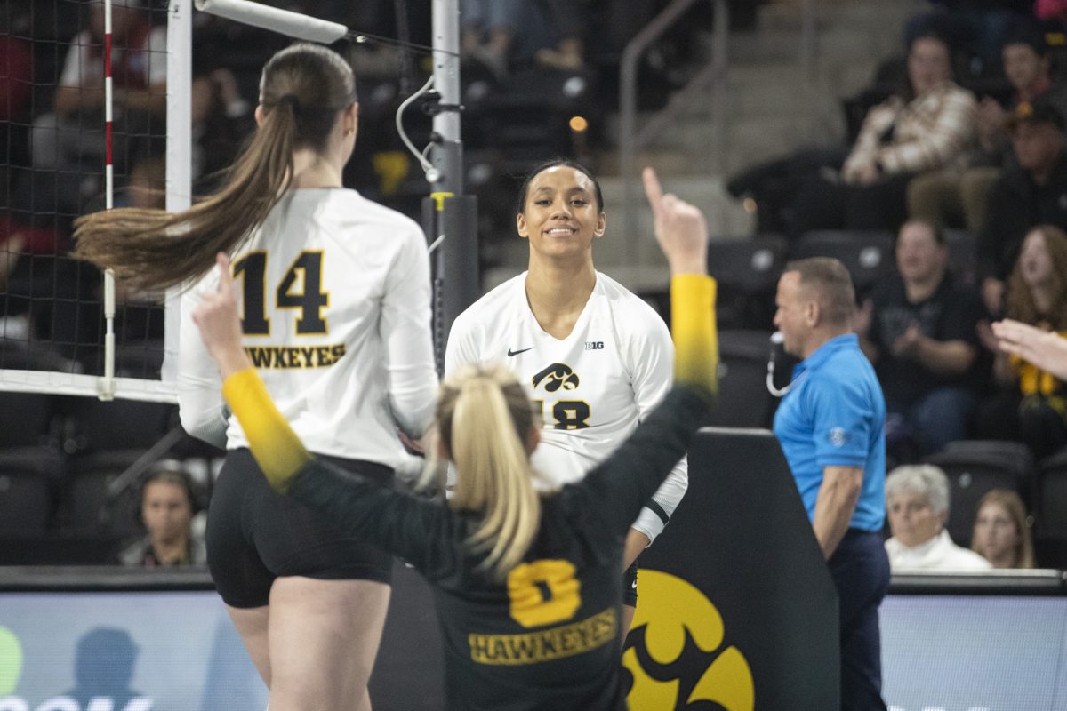 Hawkeyes celebrate after a point during a volleyball match between Iowa and Indiana at Xtream Arena in Coralville on Thursday, Nov, 14, 2024. The Hawkeyes defeated the Hoosiers in a sweep 3-0.