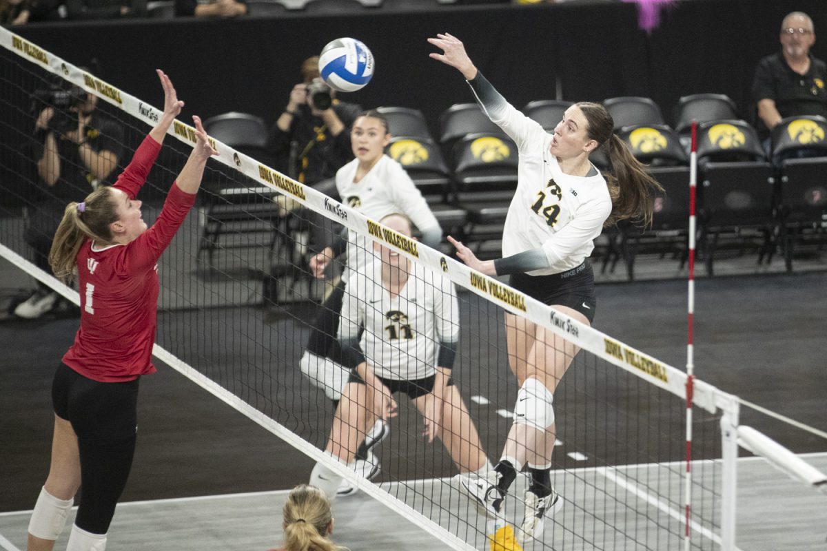 Iowa middle hitter Gracie Gibson spikes the ball during a volleyball match between Iowa and Indiana at Xtream Arena in Coralville on Thursday, Nov, 14, 2024. The Hawkeyes defeated the Hoosiers in a sweep 3-0.