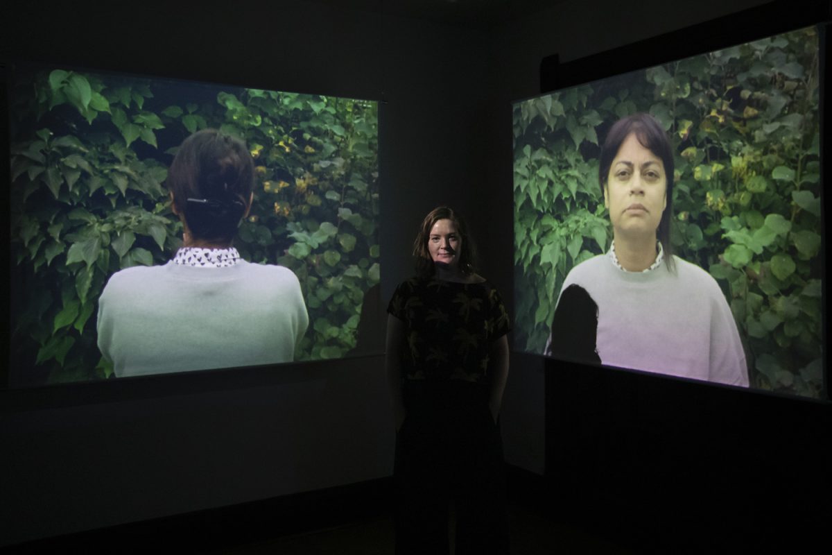 Clare Samuel poses for a portrait at the opening reception of her moving image media installation “A disturbance in the Air” at Public Space One on Friday, Nov. 15, 2024. Samuel is a visual artist and writer originally from Northern Ireland and now based in Toronto, Canada.