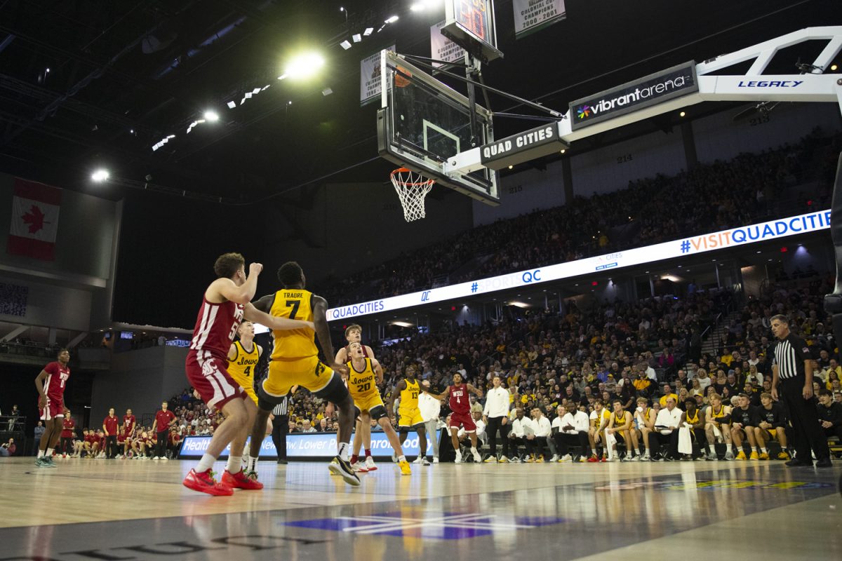 The Hawkeyes defend against the Coyotes during a men's basketball game between Iowa and Washington State at Vibrant Arena in Moline, Illinois, on Friday, Nov. 15, 2024.