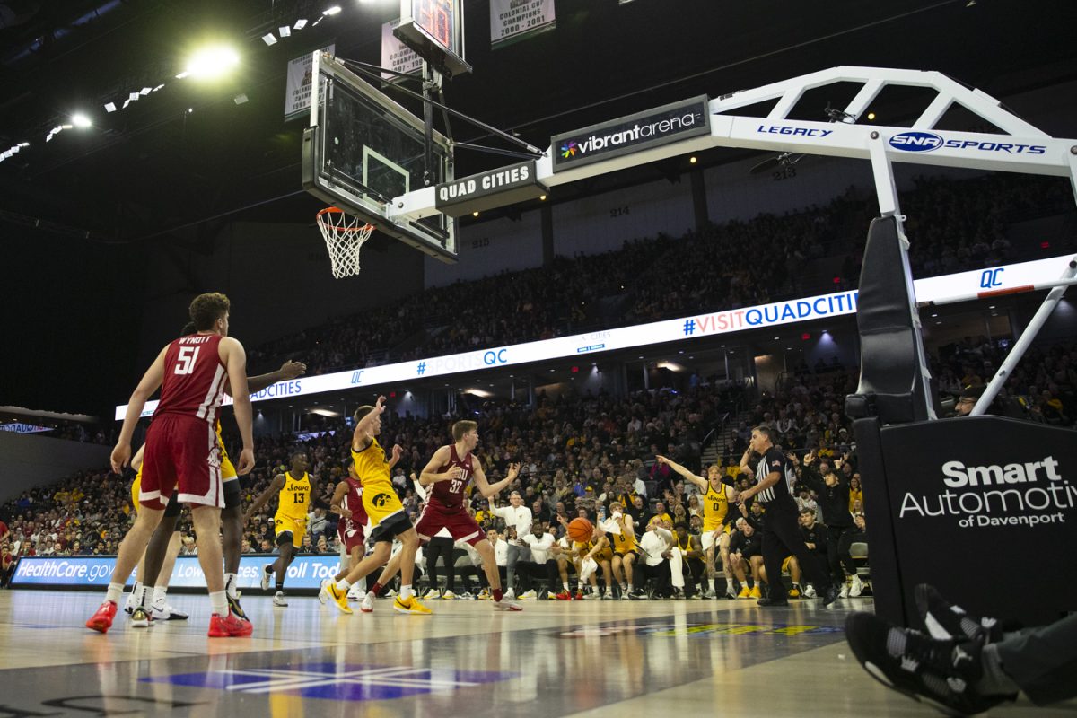 Players react to a call during a men's basketball game between Iowa and Washington State at Vibrant Arena in Moline, Illinois, on Friday, Nov. 15, 2024.