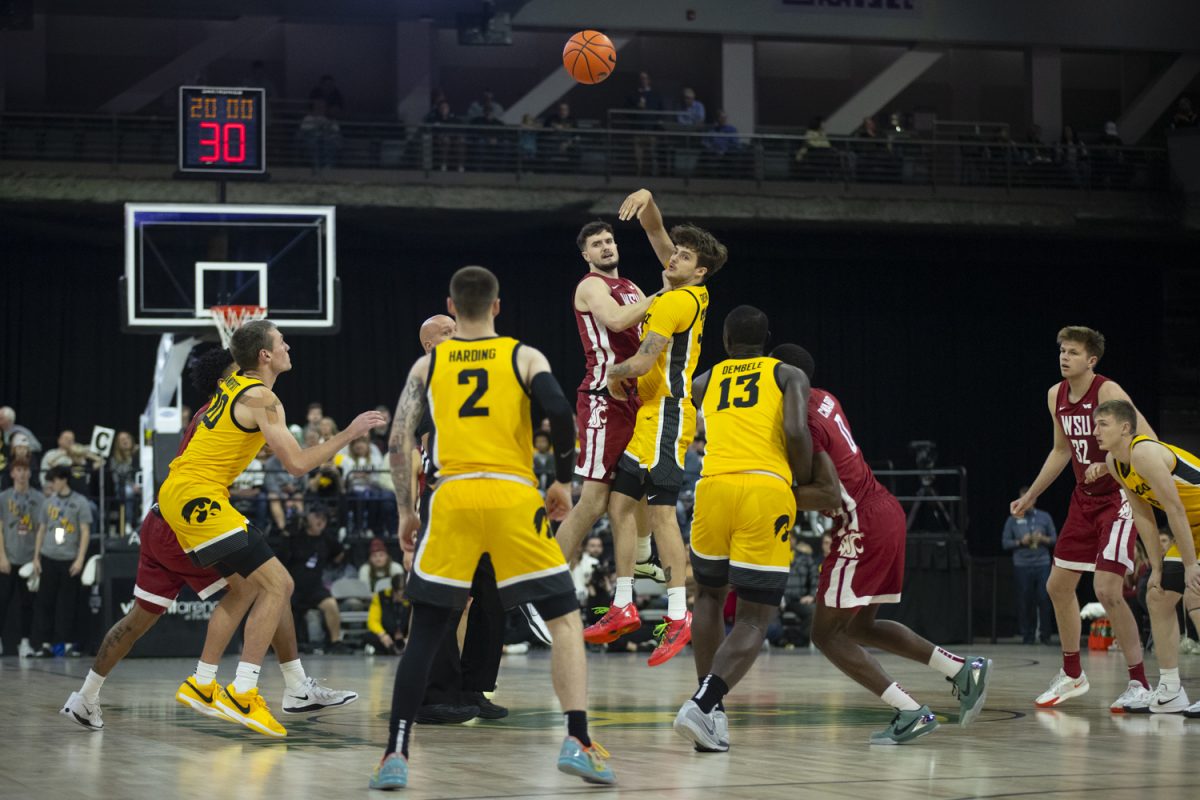 Iowa guard Owen Freeman wins the tip-off during a men's basketball game between Iowa and Washington State at Vibrant Arena in Moline, Illinois, on Friday, Nov. 15, 2024. The Hawkeyes defeated the Cougars 76-66.