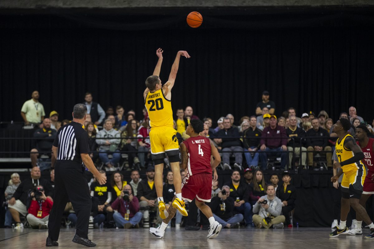 Iowa forward Payton Sandfort attempts a three-point field goal during a men's basketball game between Iowa and Washington State at Vibrant Arena in Moline, Illinois, on Friday, Nov. 15, 2024. The Hawkeyes defeated the Cougars 76-66.