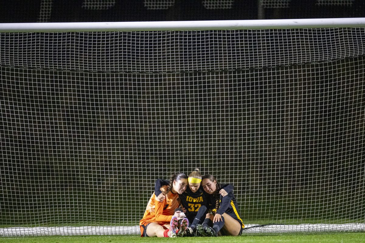 Iowa goalkeeper Macy Enneking, defender Maggie Johnston, and Iowa midfielder Rielee Fetty embrace following the NCAA women’s soccer tournament first-round match between No. 3-seed Iowa and Missouri State at the University of Iowa Soccer Complex in Iowa City on Friday, Nov. 15, 2024. The Hawkeyes defeated the Bears 2-1 and will take on the winner between Fairfield and No. 6-seed Georgetown, which will be decided after their match, which is set to start Nov. 16 at 11:00 a.m. Central Standard Time.