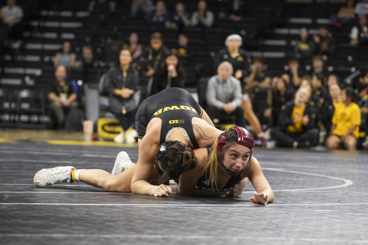 No. 1 Nanea Estrella wrestles Alanis Cedeno during the Trailblazer duals between No. 1 Iowa, No. 25 William Jewell College, and Cornell College at Carver-Hawkeye Arena in Iowa City on Saturday, Nov. 16, 2024. Iowa defeated Cornell, 47-0 and William Jewell, 43-3.