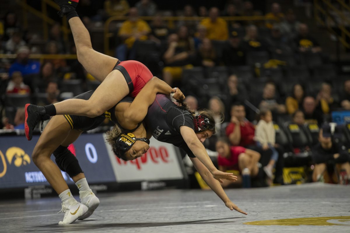 Iowa  No. 2 160-pound Kennedy Blades throws William Jewell College 160-pound Nylease Yzagere during  the Trailblazer duals between No. 1 Iowa, No. 25 William Jewell College, and Cornell College at Carver-Hawkeye Arena in Iowa City on Saturday, Nov. 16, 2024. Iowa defeated Cornell, 47-0 and William Jewell, 43-3.