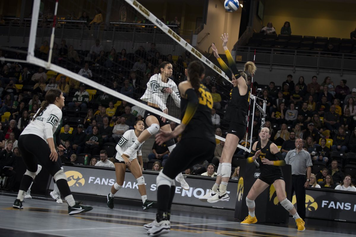 Iowa's Hannah Whittingstall hits during a volleyball game between Iowa and Michigan State Xtreme Arena in Coralville on Sunday, Nov. 17, 2024. The Spartans defeated the Hawkeyes 3-0.