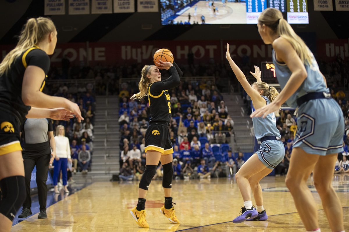 Iowa’s Lucy Olsen makes a three point attempt during an Iowa women’s basketball game against Drake at the Knapp Center on Nov. 17 in Des Moines. The Hawkeyes defeated the Bulldogs, 86-73, with standout performances on both teams.