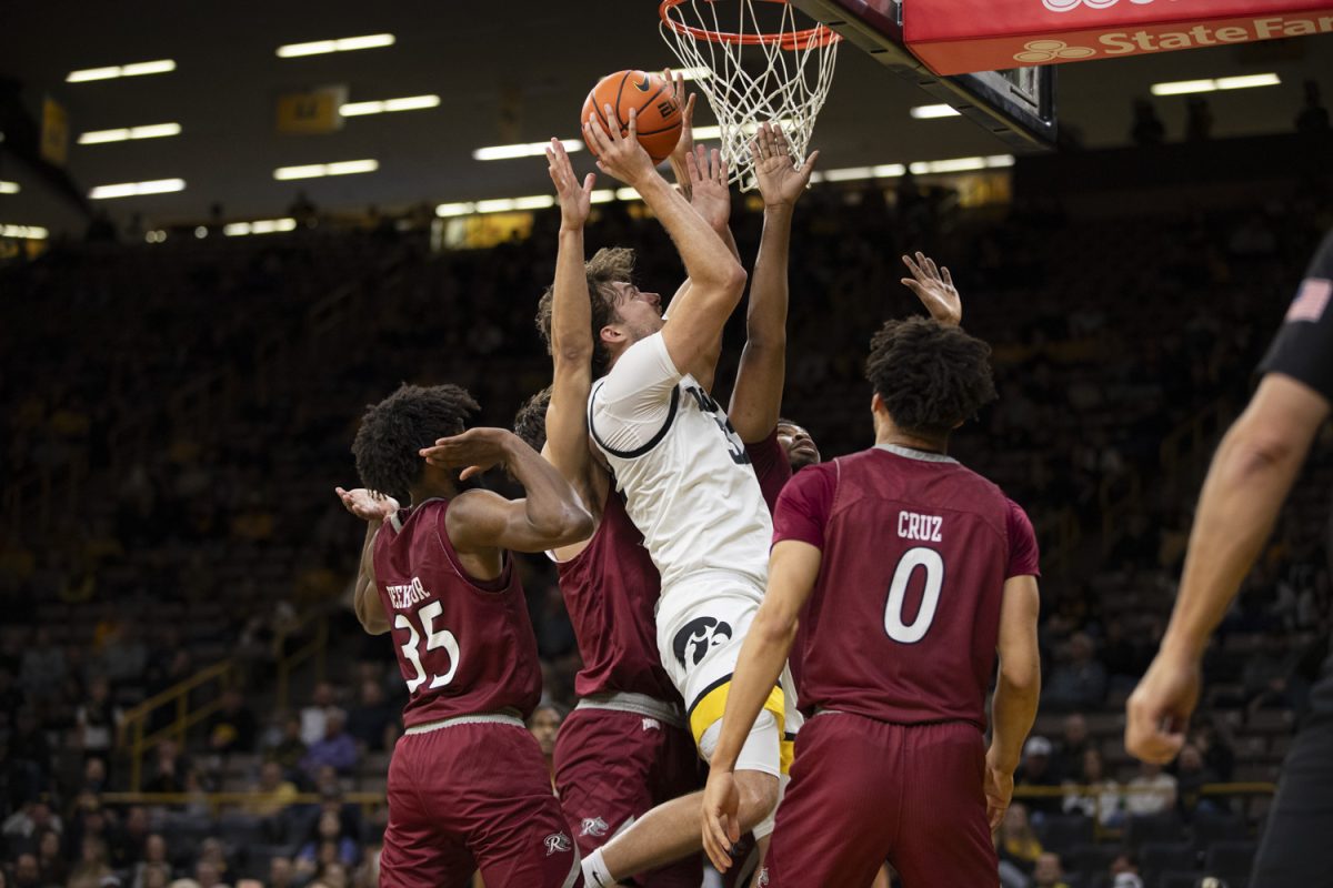 Owen Freeman goes up for a shot during an Iowa men’s basketball game against Rider University at Carver-Hawkeye Arena on Nov. 19  The Hawkeyes defeated the Broncs, 83-58.