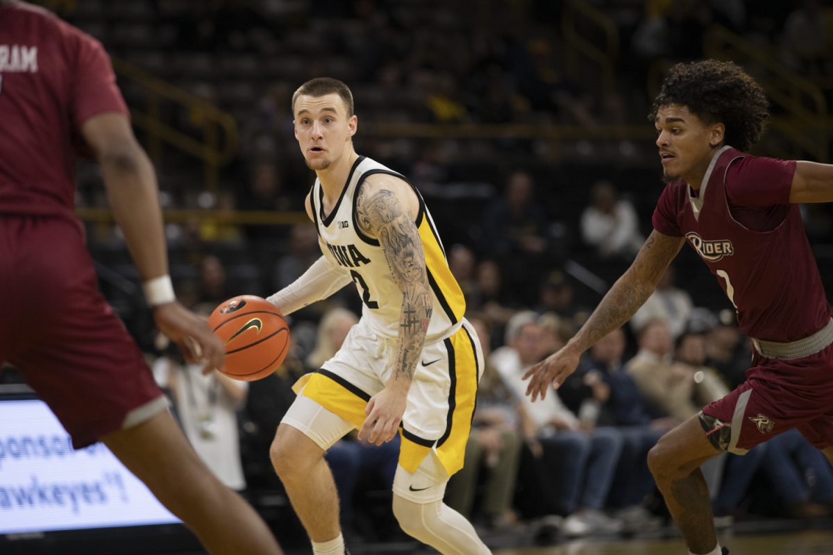 Brock Harding looks for an open pass during an Iowa men’s basketball game against Rider University at Carver-Hawkeye Arena on Nov. 19  The Hawkeyes defeated the Broncs, 83-58.