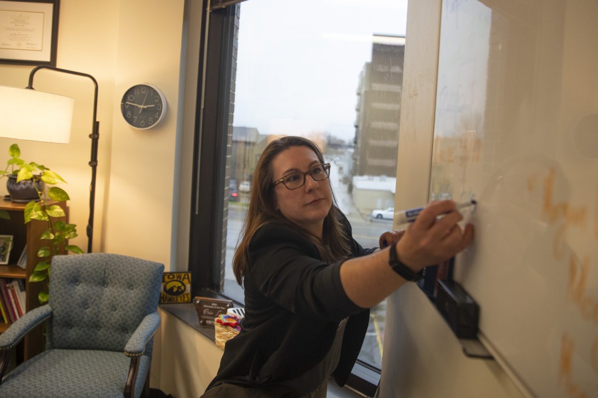 Erin Lane works in her office at the Lindquist Center in Iowa City on Monday, Nov. 18, 2025. Professor Lane was awarded the 2024 School Counselor Advocate of the Year Award from the Iowa School Counselor Association (ISCA).