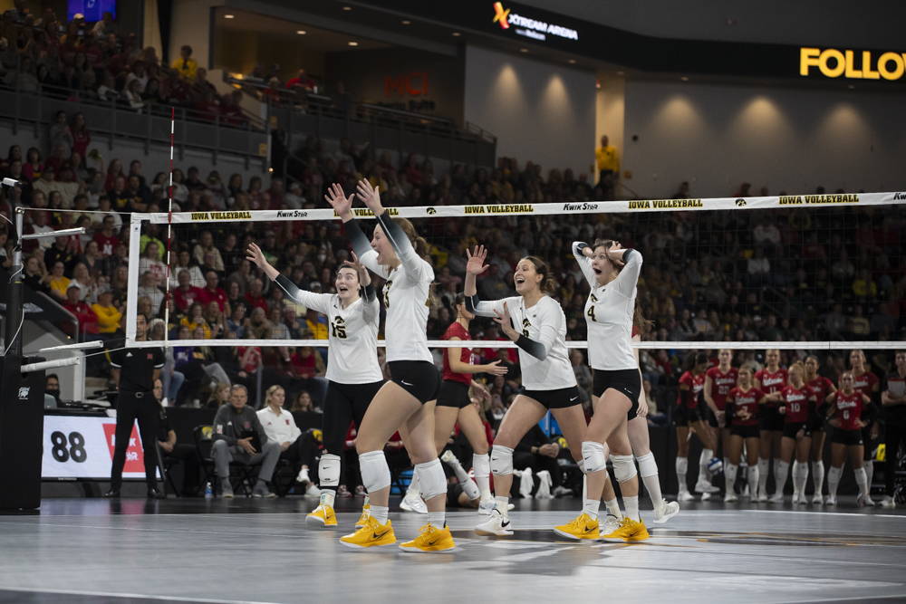 Iowa players celebrate after scoring during a women’s volleyball game between Iowa and Nebraska at Xtream Arena in Coralville on Wednesday, Nov. 20, 2024. The Huskers defeated the Hawkeyes in a sweep 3-0.