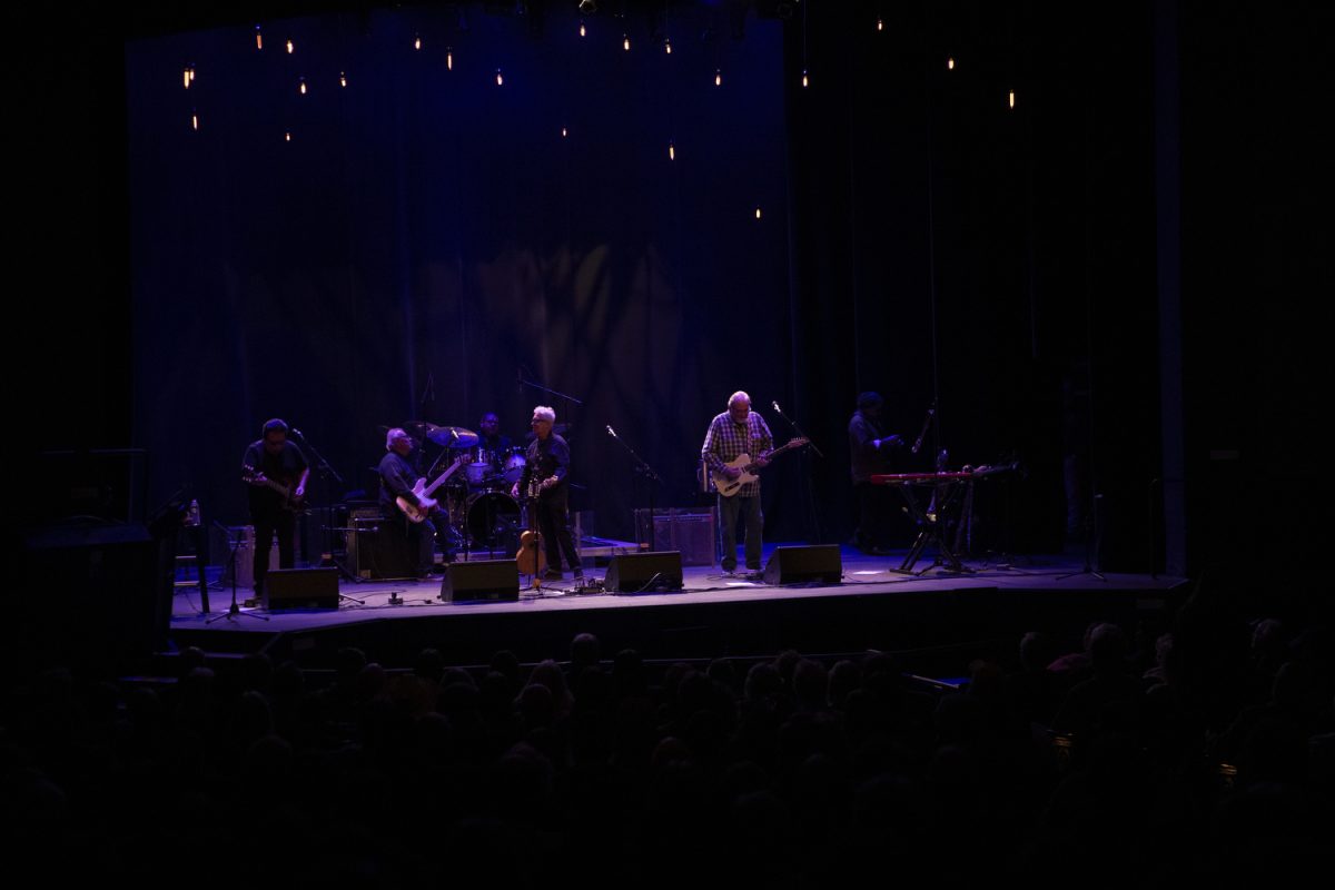 Los Lobos performs at the Englert Theatre in Iowa City for their 50th Anniversary Tour on Nov. 20, 2024. Los Lobos enters the stage as the audience cheers.