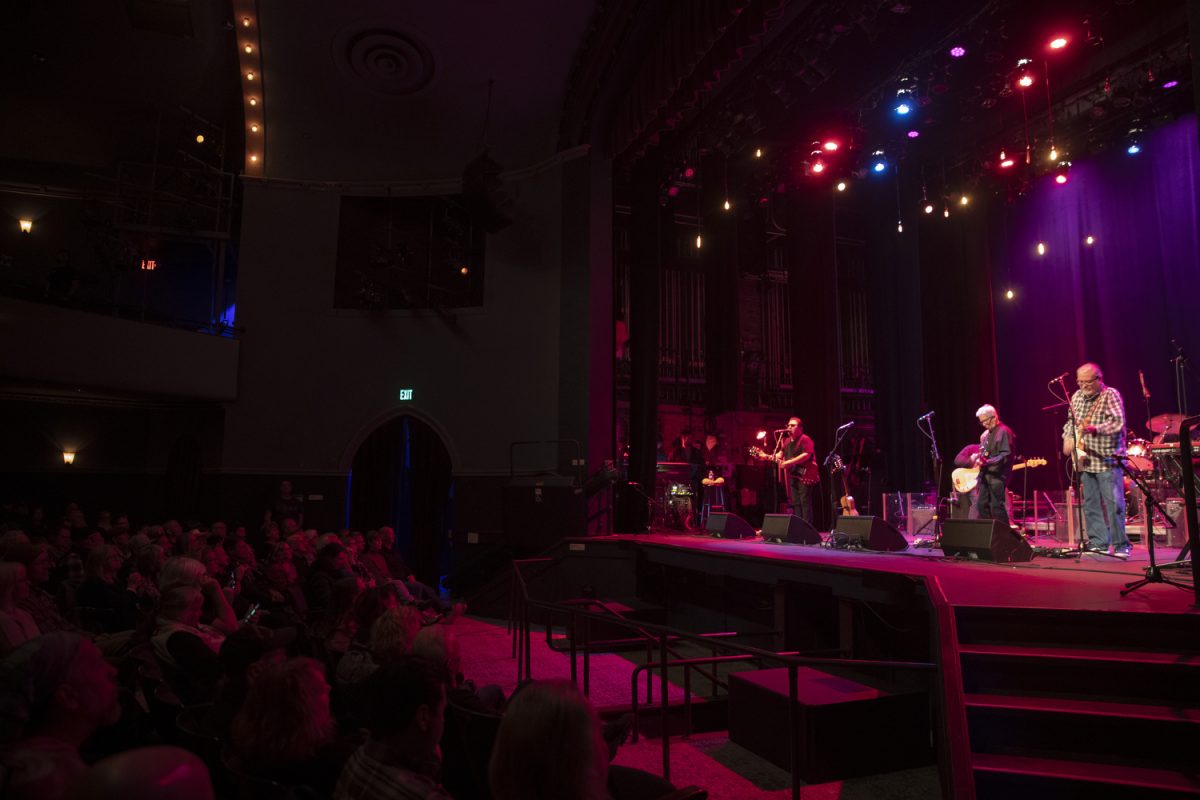 Los Lobos performs at the Englert Theatre in Iowa City for their 50th Anniversary Tour on Nov. 20, 2024. Los Lobos plays while the audience watches.