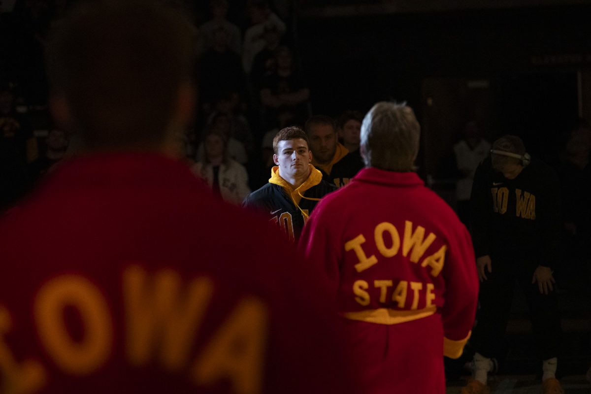 Iowa’s No.2 165-pound Mikey Caliendo stares down Iowa State’s Connor Euton before a Cy-Hawk men’s wrestling dual between No. 2 Iowa and No. 12 Iowa State at Carver-Hawkeye Arena in Iowa City on Saturday, Nov. 23, 2024. The Hawkeyes defeated the Cyclones 21-15.