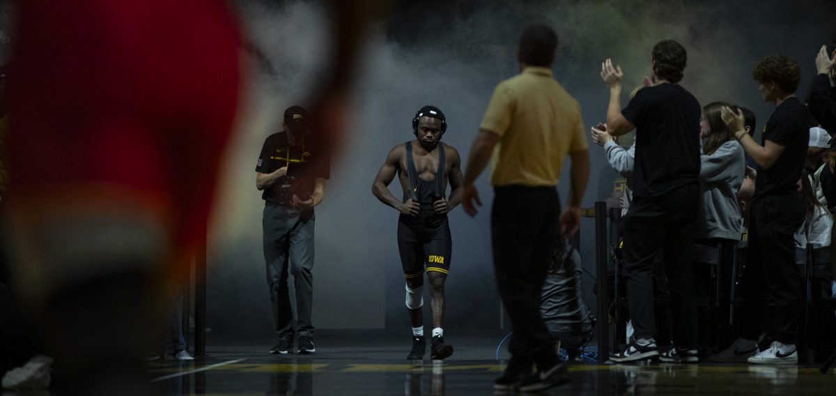 Iowa’s No.1 157-pound Jacori Teemer walks out before his match during a Cy-Hawk men’s wrestling dual between No. 2 Iowa and No. 12 Iowa State at Carver-Hawkeye Arena in Iowa City on Saturday, Nov. 23, 2024. The Hawkeyes defeated the Cyclones 21-15.