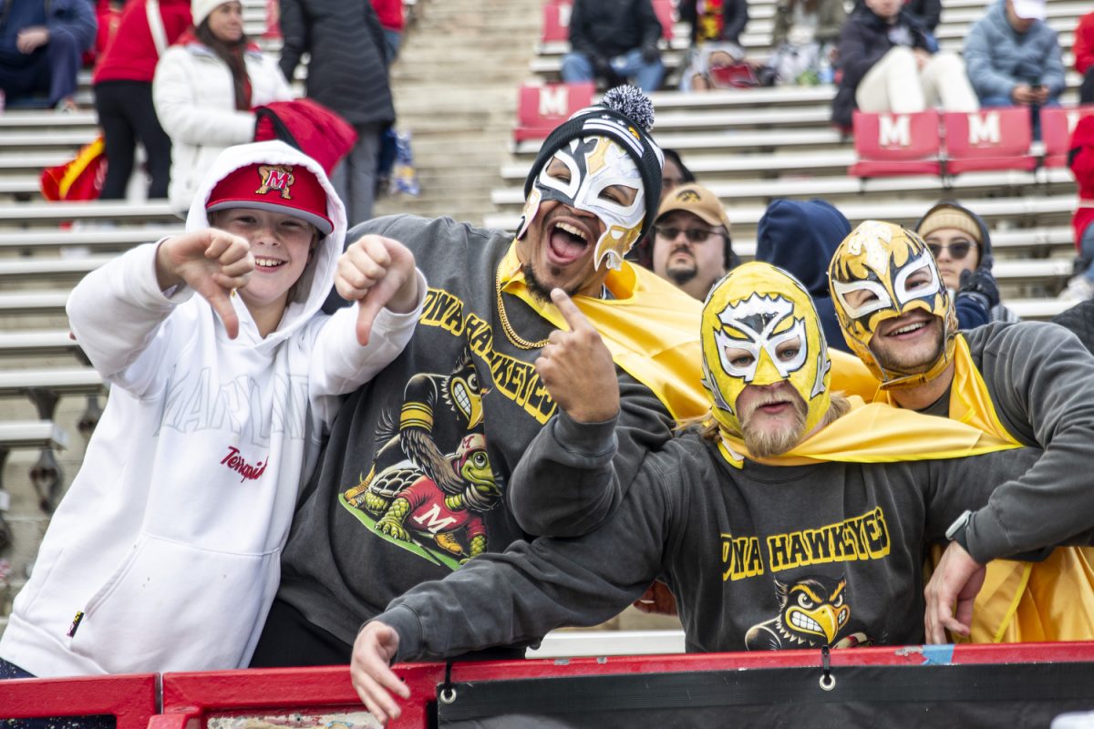 Fans acknowledge the camera during a football game between Iowa and Maryland at SECU Stadium in College Park, Md. on Saturday, Nov. 23, 2024. The Hawkeyes defeated the Terrapins 29-13.