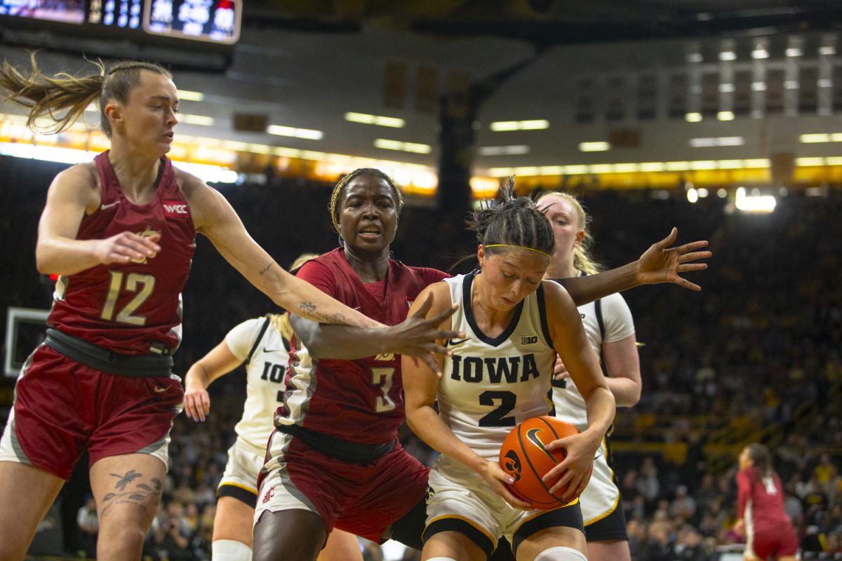 Iowa guard Taylor McCabe rebounds the ball during a women's basketball game between Iowa and Washington State at Carver-Hawkeye Arena in Iowa City, on Sunday, Nov. 24, 2024. The Hawkeyes defeated the Cougars 72-43.