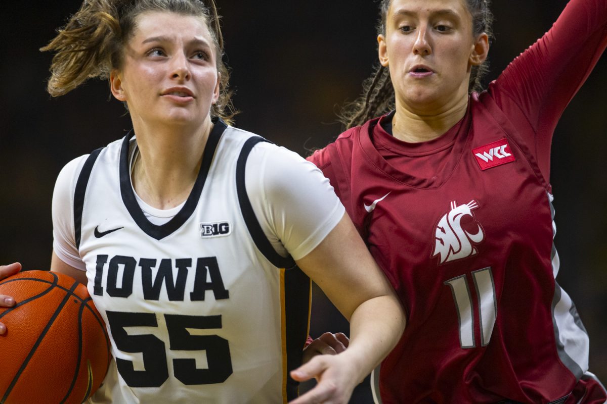 Taylor Stremlow drives in during a women's basketball game between Iowa and Washington State at Carver-Hawkeye Arena in Iowa City, on Sunday, Nov. 24, 2024. The Hawkeyes defeated the Cougars 72-43.