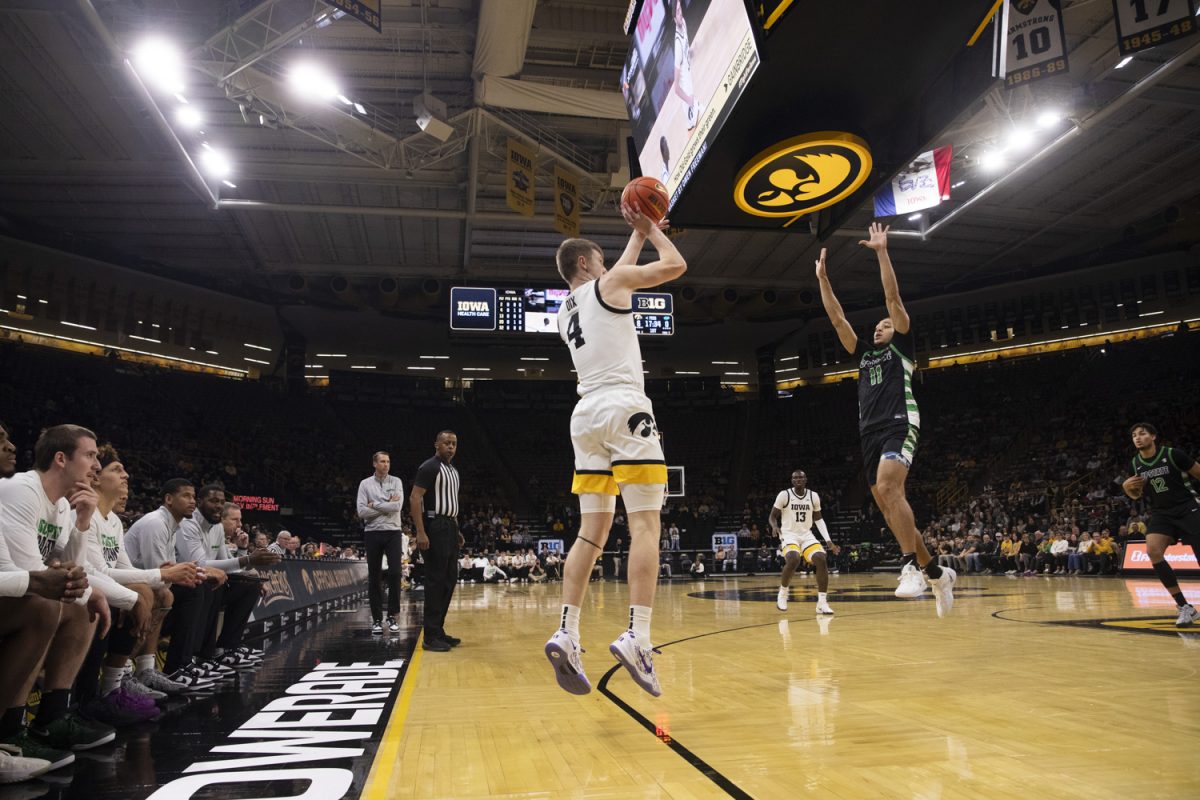 Josh Dix shoots a three pointer during a men’s basketball game between Iowa and USC Upstate at Carver-Hawkeye Arena in Iowa City, on Tuesday, Nov. 26, 2024. The Hawkeyes defeated the Spartans 110-77.