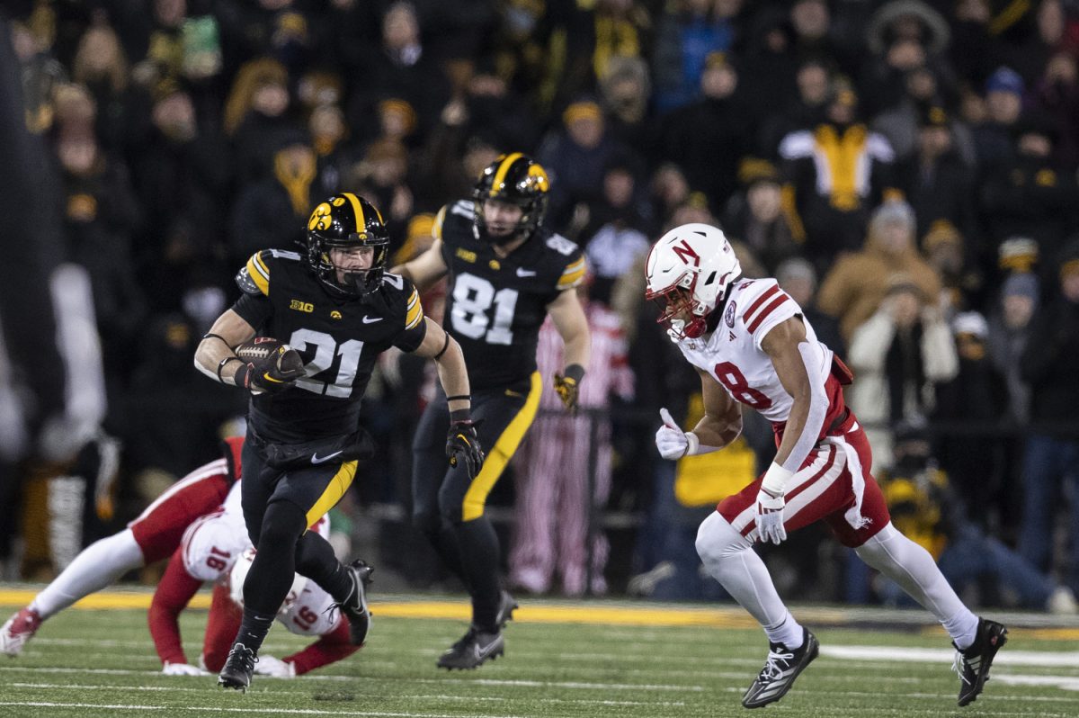 Iowa wide receiver Kaden Wetjen returns a punt during a football game between Iowa and Nebraska at Kinnick Stadium in Iowa City on Friday, Nov. 29, 2024. Iowa defeated Nebraska, 13-10.