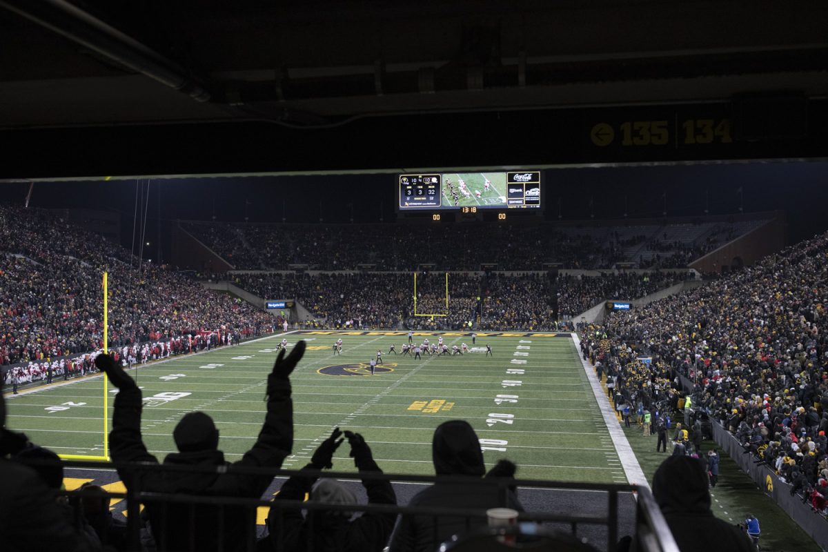 Fans react as Iowa defense prepares to defend during a football game between Iowa and Nebraska at Kinnick Stadium in Iowa City on Friday, Nov. 29, 2024. Iowa defeated Nebraska, 13-10.