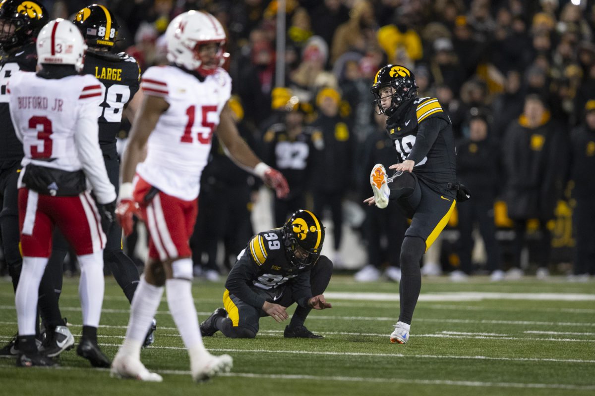 Iowa kicker Drew Stevens kicks the ball during a football game between Iowa and Nebraska at Kinnick Stadium in Iowa City on Friday, Nov. 29, 2024. Iowa defeated Nebraska, 13-10.