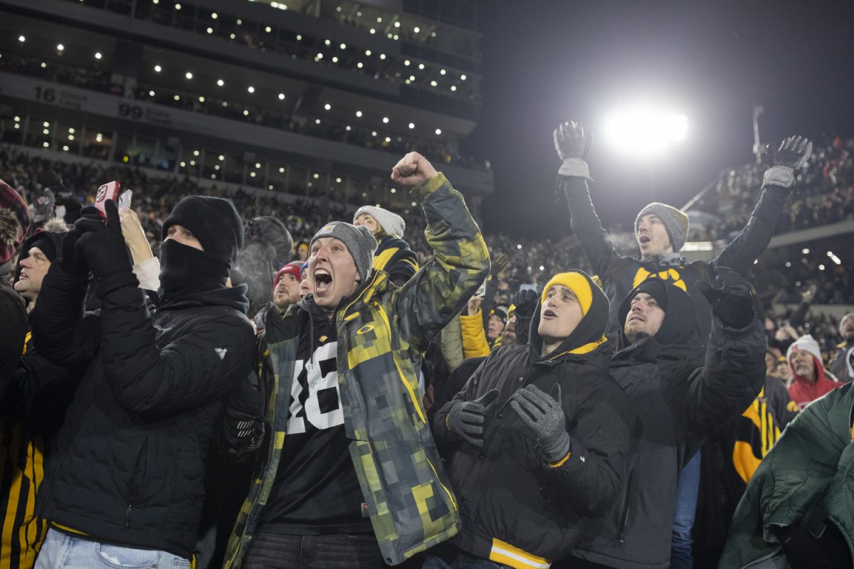 Iowa fans celebrate as a field goal is made to win the game in the last six seconds during a football game between Iowa and Nebraska at Kinnick Stadium in Iowa City on Friday, Nov. 29, 2024. Iowa defeated Nebraska, 13-10