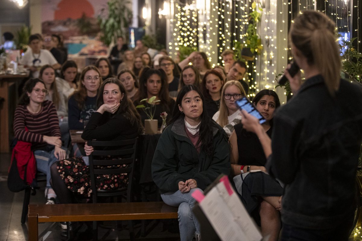 Attendees listen to speaker Molly Monk during “Talking Bodies”, a Reinvention of the Vagina Monologues at the Greenhouse in Iowa City on Sunday, Nov. 3, 2024. The event was organized by Medical Students for Choice.