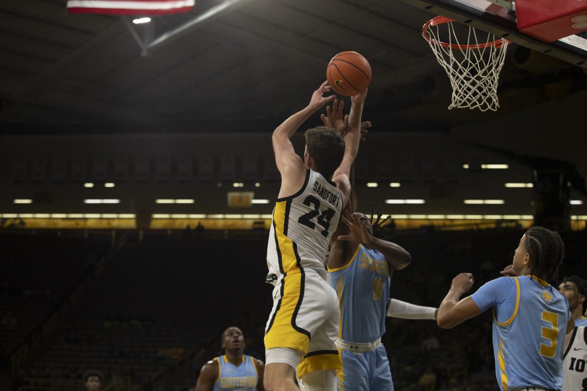 Pryce Sandfort jumps for a rebound during the Iowa Men’s basketball game against Southern University on Nov. 7 at Carver Hawkeye Arena in Iowa City, Iowa. The Hawkeye men battled and won 89-74 over the Jaguars.