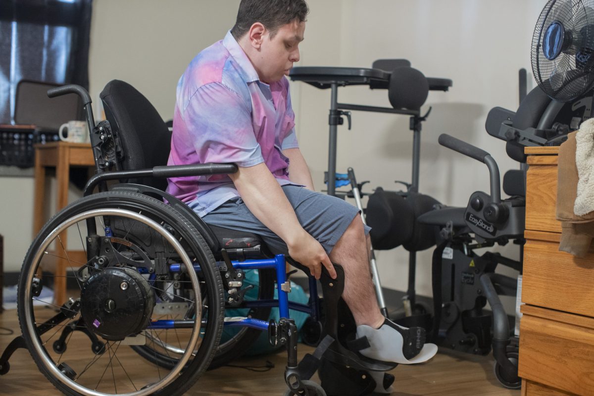 Kristian Marchand, a freshman at the University of Iowa, gets ready to study on Friday, Oct. 25, 2024. Marchand recently started a petition to make Macbride hall more accessible for those with physical disabilities.