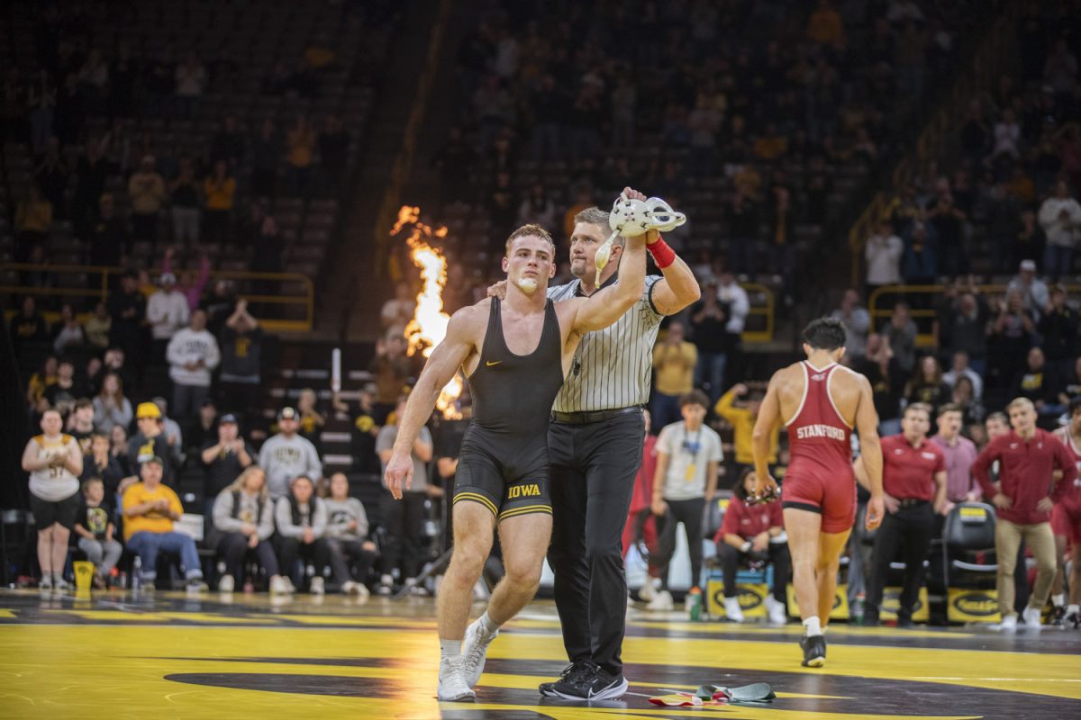 Iowa No. 2 165-pound Michael Caliendo reacts after defeating Stanford No. 7 Hunter Garvin during No. 2 Iowa’s first home dual against No. 20 Stanford at Carver-Hawkeye Arena in Iowa City on Nov. 9. The Hawkeyes defeated the Trees, 32-9. Caliendo defeated Garvin, 17-12.