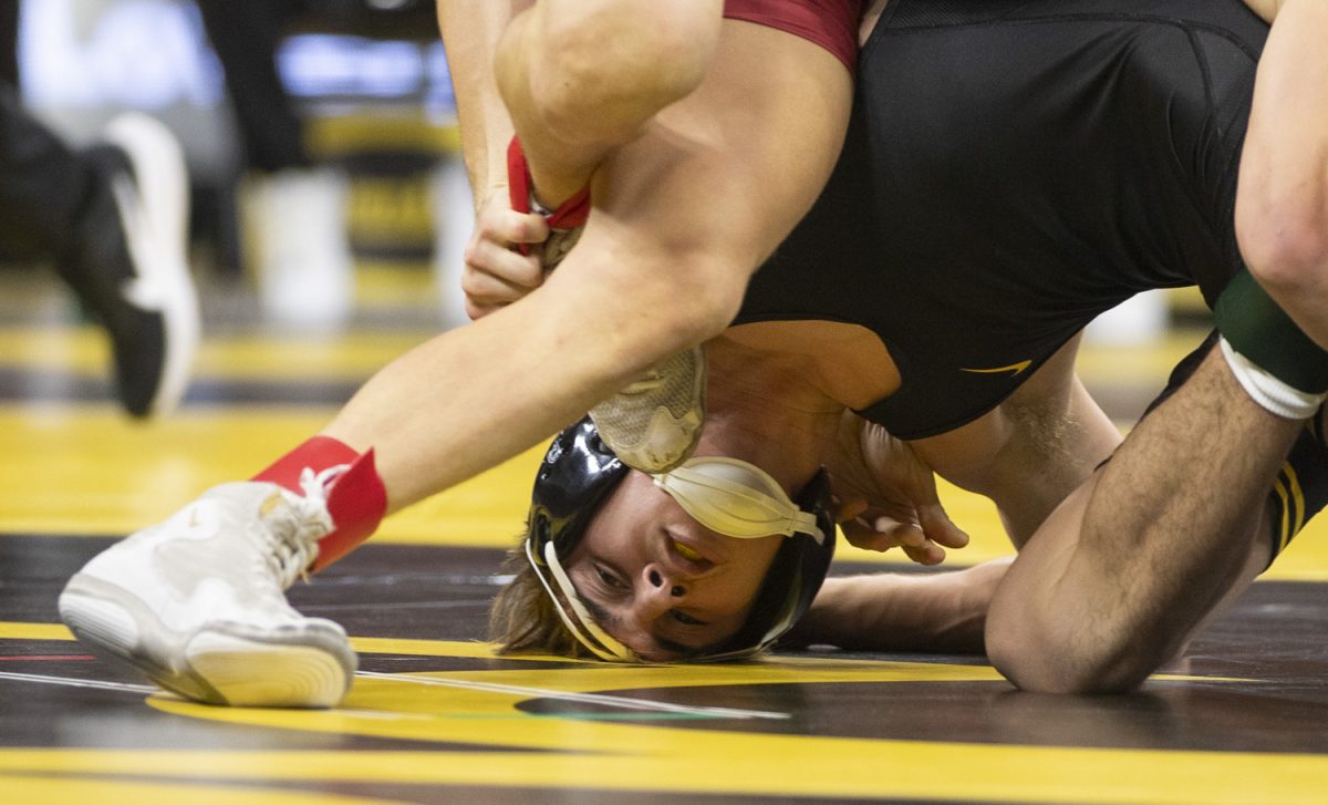 Stanford No. 23 133-pound Tyler Knox wrestles Iowa No. 7 Drake Ayala during No. 2 Iowa’s first home dual against No. 20 Stanford at Carver-Hawkeye Arena in Iowa City on Saturday, Nov. 9, 2024. The Hawkeyes defeated the Tree, 32-9. Ayala was defeated by Stanford No. 23 Tyler Knox.