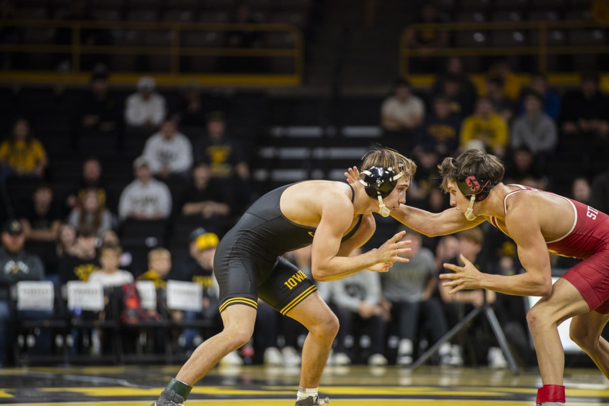 Stanford No. 23 133-pound Tyler Knox wrestles Iowa No. 7 Drake Ayala during No. 2 Iowa’s first home dual against No. 20 Stanford at Carver-Hawkeye Arena in Iowa City on Saturday, Nov. 9, 2024. The Hawkeyes defeated the Tree, 32-9. Ayala was defeated by Stanford No. 23 Tyler Knox.