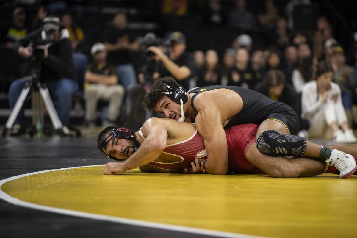 Iowa No. 2 197-pound Stephen Buchanan wrestles Stanford No. 17 Nick Stemmet during No. 2 Iowa’s first home dual against No. 20 Stanford at Carver-Hawkeye Arena in Iowa City on Saturday, Nov. 9, 2024. The Hawkeyes defeated the Tree, 32-9. Buchanan defeated Stemmet, 18-1.