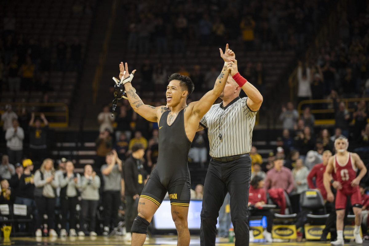 Iowa no. 4 149-pound Kyle Parco celebrates after winning a matcha against Stanford 149-pound Jaden Abas during No. 2 Iowa’s first home dual against No. 20 Stanford at Carver-Hawkeye Arena in Iowa City on Saturday, Nov. 9, 2024. The Hawkeyes defeated the Tree, 32-9. Parco defeated Abas, 15-0.