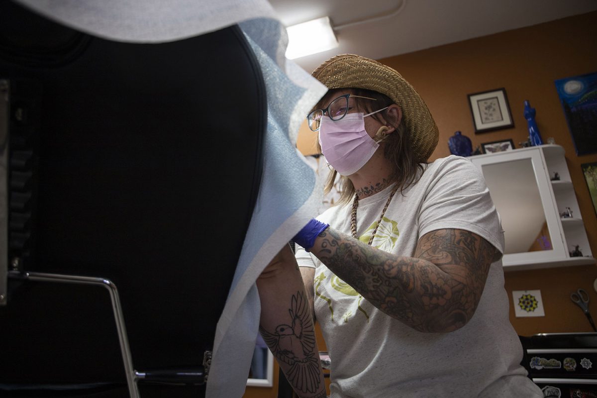 Michelle Balhan works on Kayla Way’s blackout sleeve at Velvet Lotus Tattoo on Sept. 23, 2021. Balhan’s shop and Swanky Bits had a “Tats for Tots” fundraiser earlier this fall.