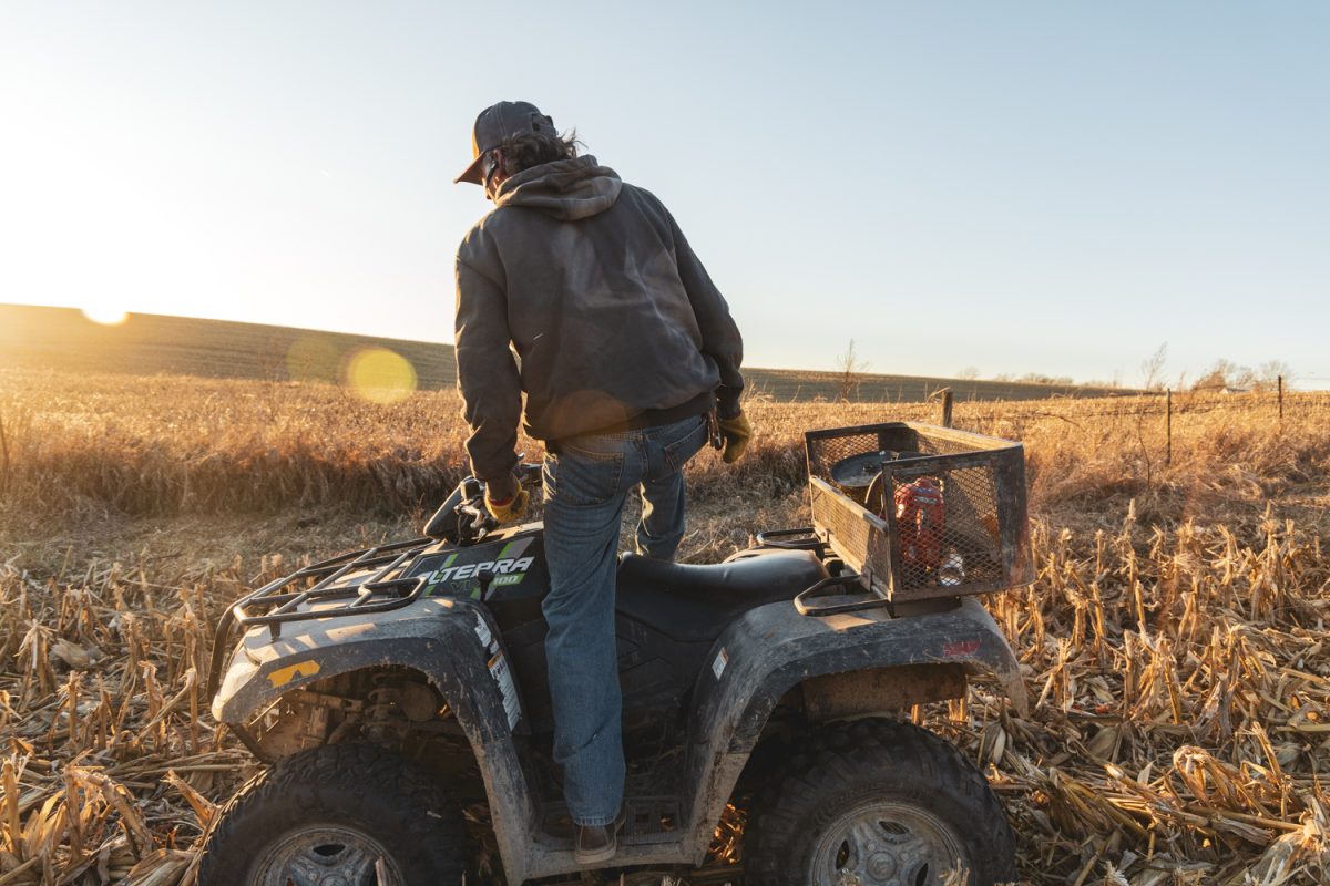 Rick Kasper traverses his farm near Tiffin, Iowa, on Dec. 8. Kasper used his four-wheeler to drive around and check on his cattle.