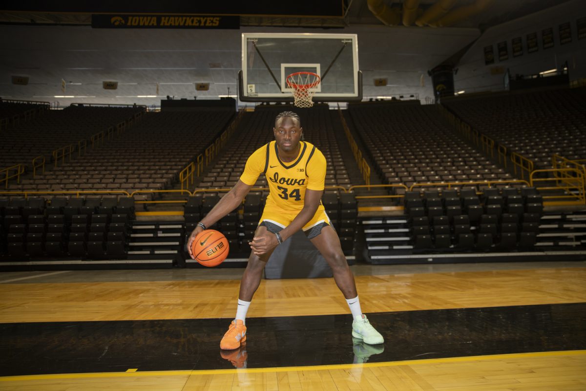 Iowa forward Chris Tadjo poses for a portrait during men’s basketball media day at Carver-Hawkeye Arena in Iowa City on Monday, October. 7, 2024. The team took interviews from the media and held an open practice.