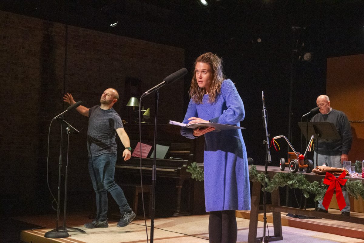 Allison Meyer acts while the cast creates sound effects onstage during a performance of It’s A Wonderful Life: A Radioplay at Riverside Theatre in Iowa City on Friday, Nov. 22, 2024. The show will run from Nov. 29 to Dec. 15.