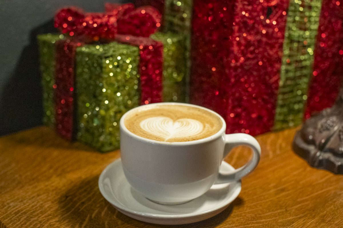 A Gingerbread Caramel Latte sits on the counter of Java House in Iowa City on Tuesday, Dec. 3, 2024. Coffeeshops across Iowa City have been offering holiday drinks for the winter season.