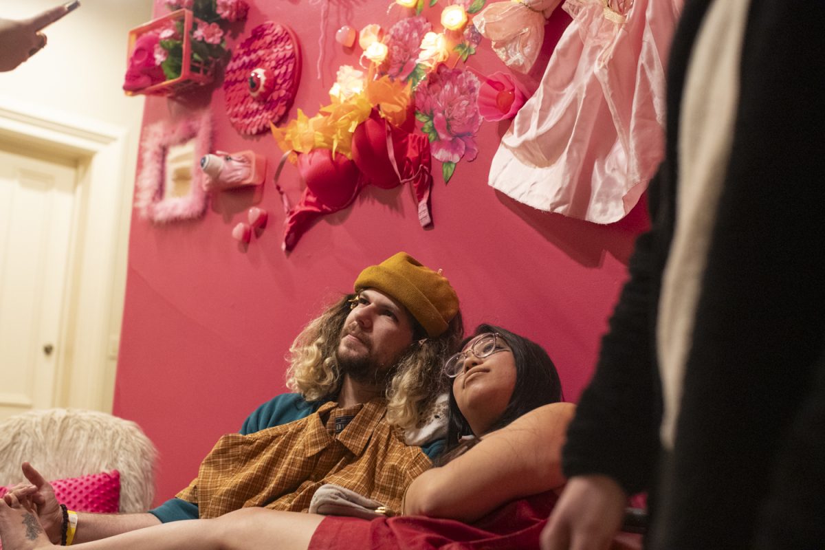 Attendees mingle during the Dada Prom, held at Public Space One on Saturday, Dec. 7, 2024. The event, celebrating the absurdist art form, had an immersive exhibit throughout the venue and a costume contest for attendees who dressed up.