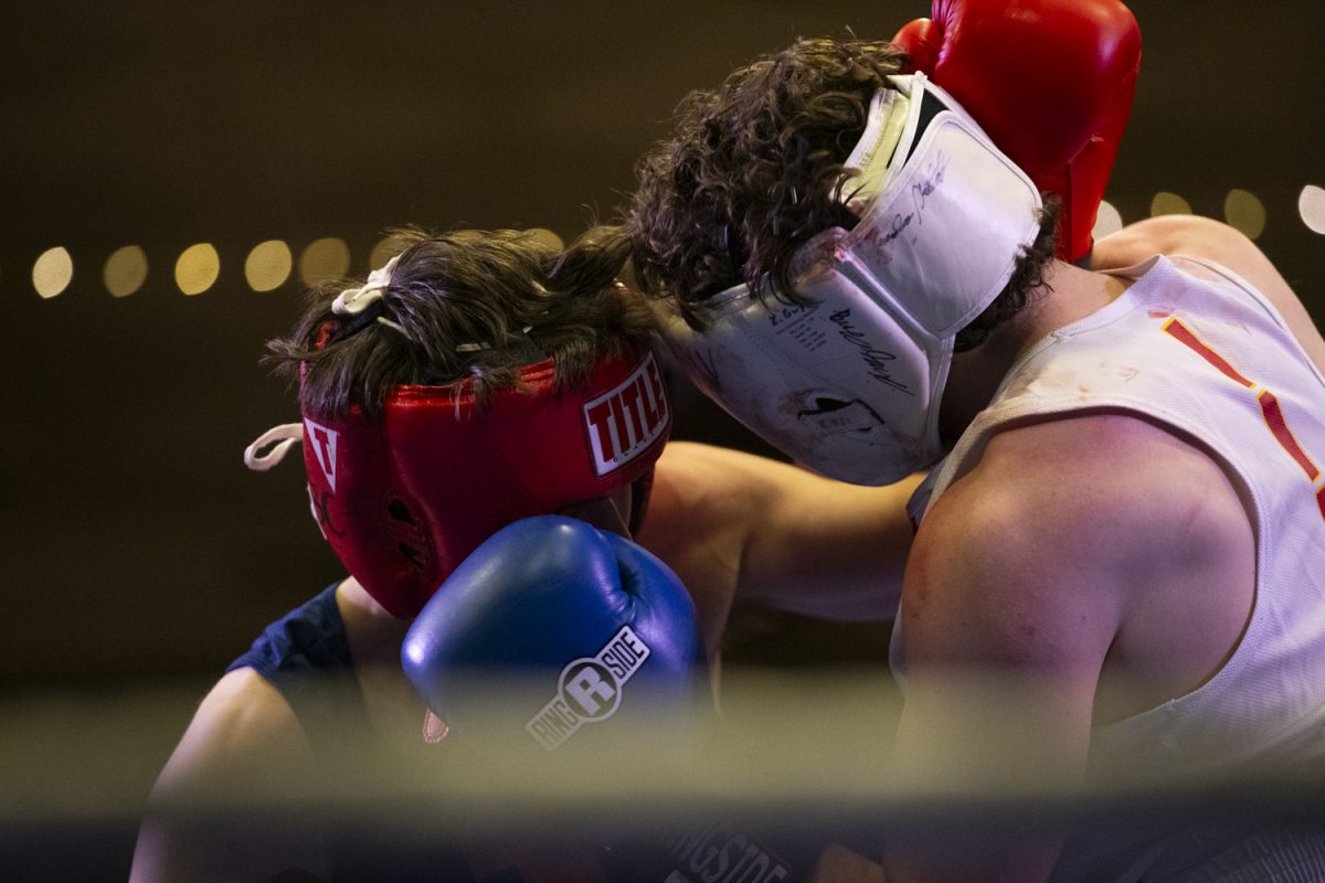 Boxers face off during Fall Brawl, hosted by Iowa Boxing Club, at the Iowa Memorial Union at the University of Iowa on Saturday, Dec, 7, 2024. Numerous schools including Iowa State, Wisconsin, and Illinois, as well as other boxing organizations fought in 11 bouts.