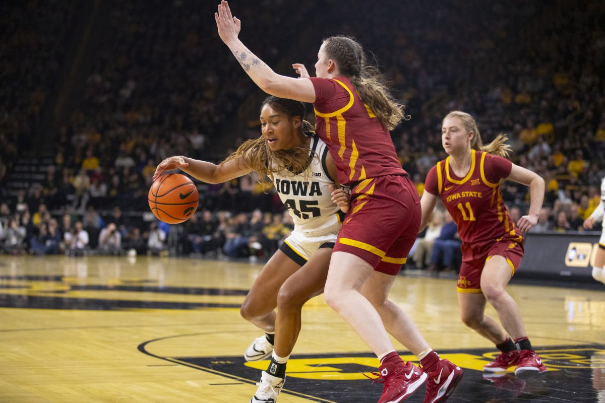 Hannah Stuelke dribbles the ball during the Iowa Corn Cy-Hawk Series, a basketball game between Iowa and Iowa State at Carver-Hawkeye Arena in Iowa City on Wednesday, Dec. 11, 2024. The Hawkeyes defeated the Cyclones 75-69.