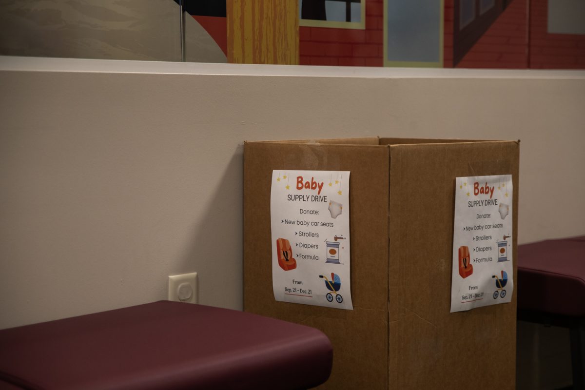 A donation drop box is seen at the WIC Center at the Johnson County Public Health Building on Thursday, Dec. 12, 2024.