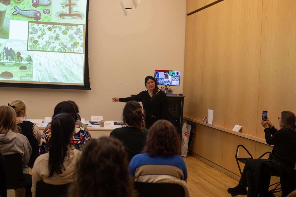 Assistant Professor Amy Huang makes a speech during a student exhibit of ink art at the Stanley Museum of Art on Thursday, Dec. 12, 2024. Students in Brushwork in Chinese Art, a class taught by Professor Huang, led presentations and showcased their work from the semester.