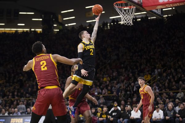 Iowa’s Brock Harding shoots a layup during a men’s basketball game between Iowa and Iowa State at Carver-Hawkeye Arena on Dec. 12, 2024. The Cyclones defeated the Hawkeyes, 89-80.