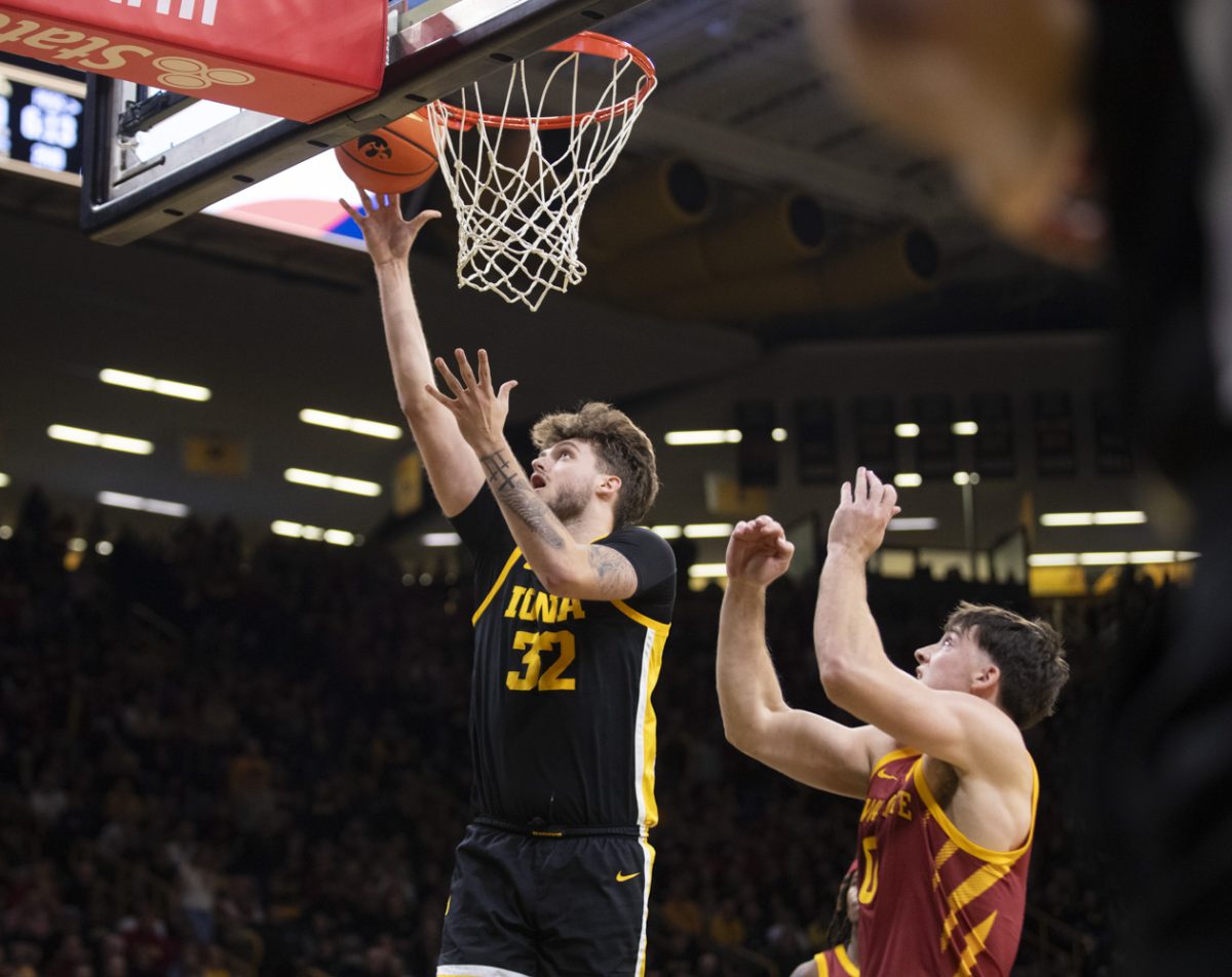 Iowa’s Owen Freeman shoots a layup during a men’s basketball game between Iowa and Iowa State at Carver-Hawkeye Arena on Dec. 12, 2024. The Cyclones defeated the Hawkeyes, 89-80.