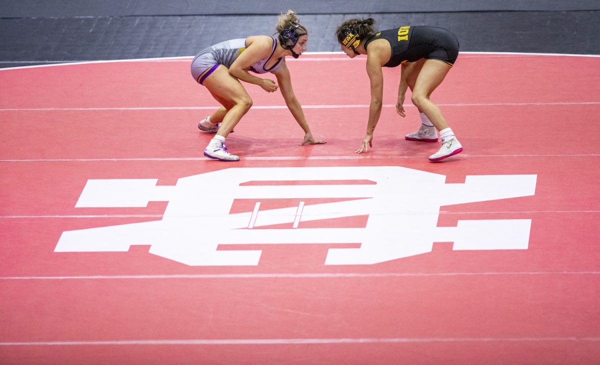 Iowa 110-pound Valarie Solorio looks at McKendree University’s Samantha Miller during the 2024 NCC Open Tournament at the North Central College Recreation Center in Naperville, Ill, on Sunday, Dec. 15, 2024. Iowa finished second place just behind North Central with a team score of 148.5 points. Solorio finished in third place North Central’s Kendra Ryan.