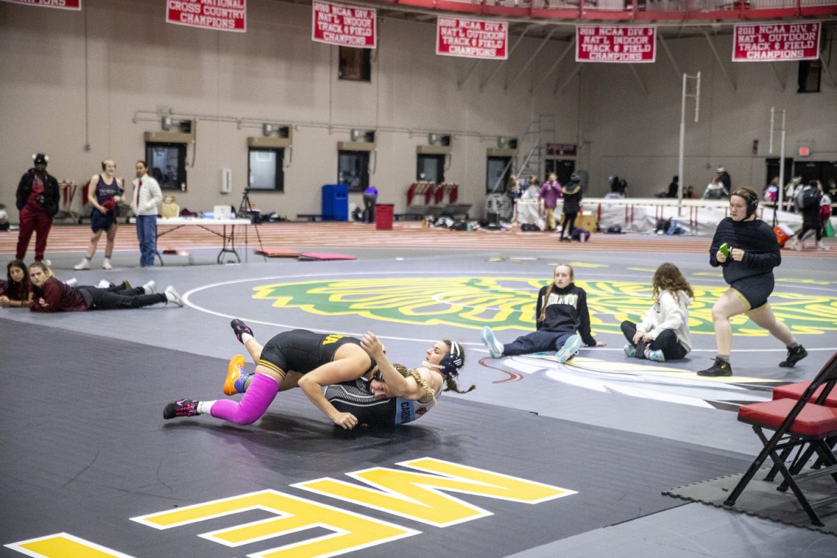 Iowa 180-pound Kylie Welker wrestles North Central’s Brittyn Corbishley during the 2024 NCC Open Tournament at the North Central College Recreation Center in Naperville, Ill, on Sunday, Dec. 15, 2024. Iowa finished second place just behind North Central with a team score of 148.5 points. Welker finished in first place.